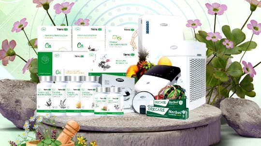 Tiens Pakistan product range of food supplements, devices and household items on a display stage